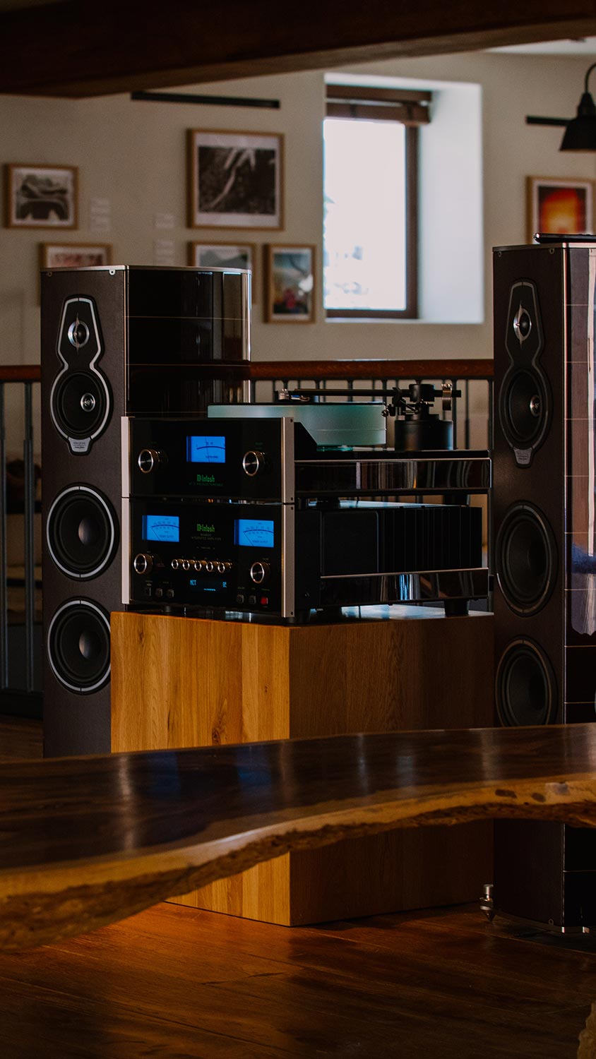 High-end stereo system with large speakers on wood floor