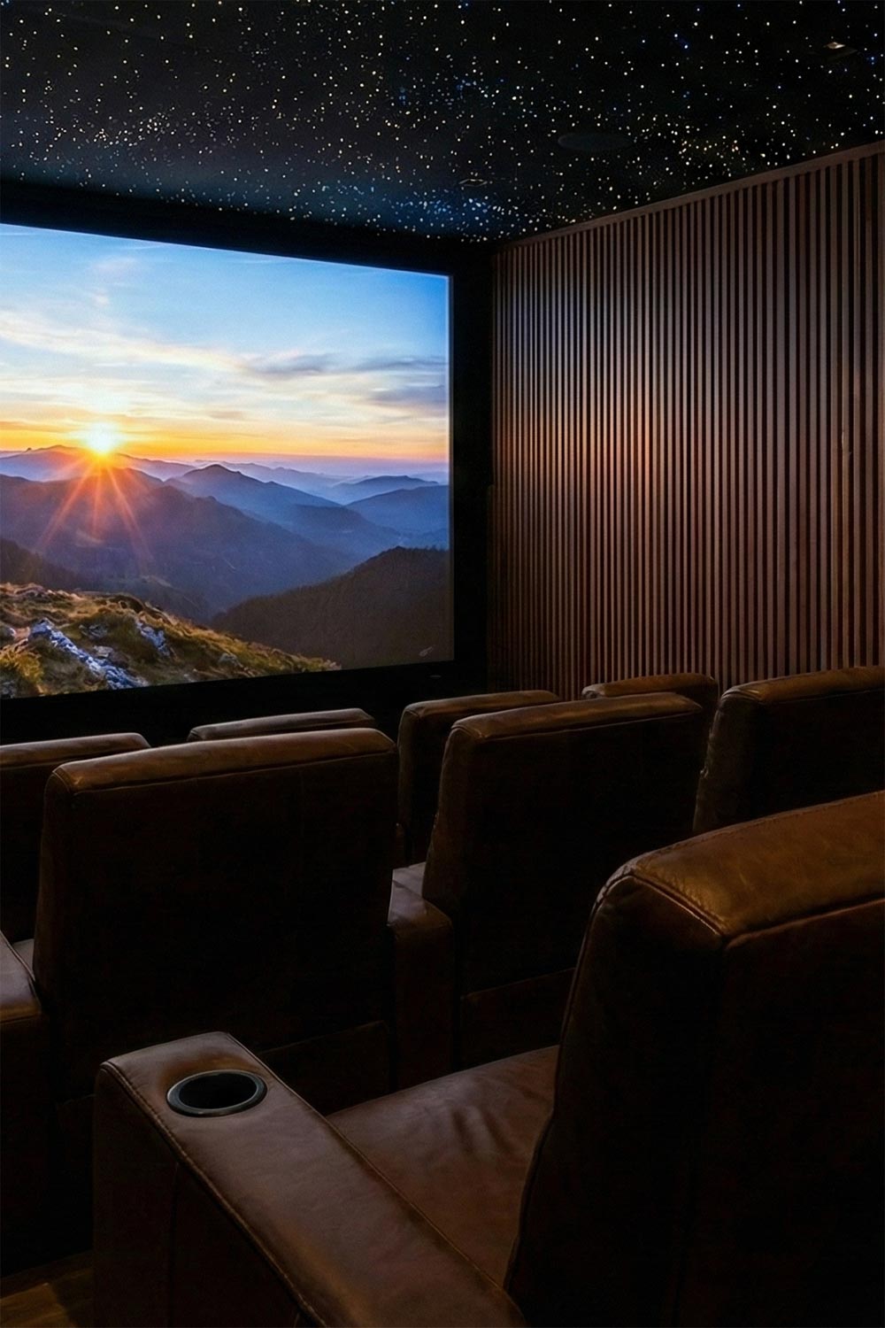 Luxury home cinema featuring brown leather seating and a starry night sky ceiling design