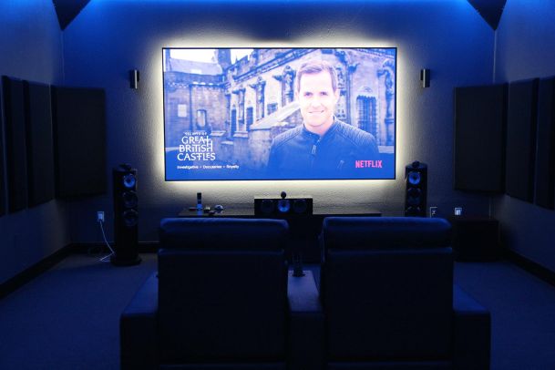 Home theater setup with Netflix documentary playing on big screen