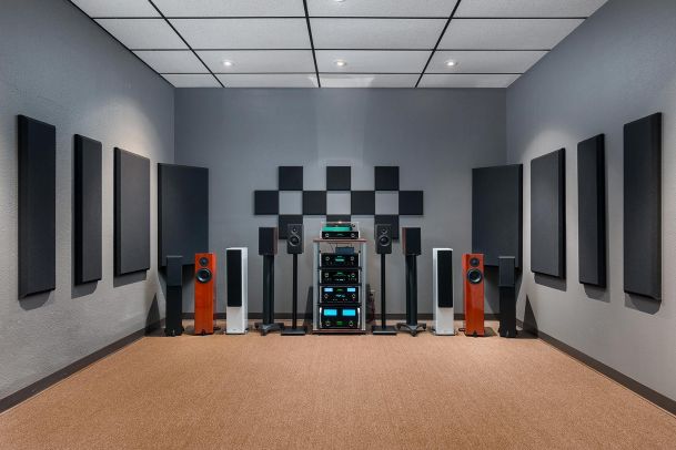 Symmetrical audio room setup with speakers and acoustic wall panels